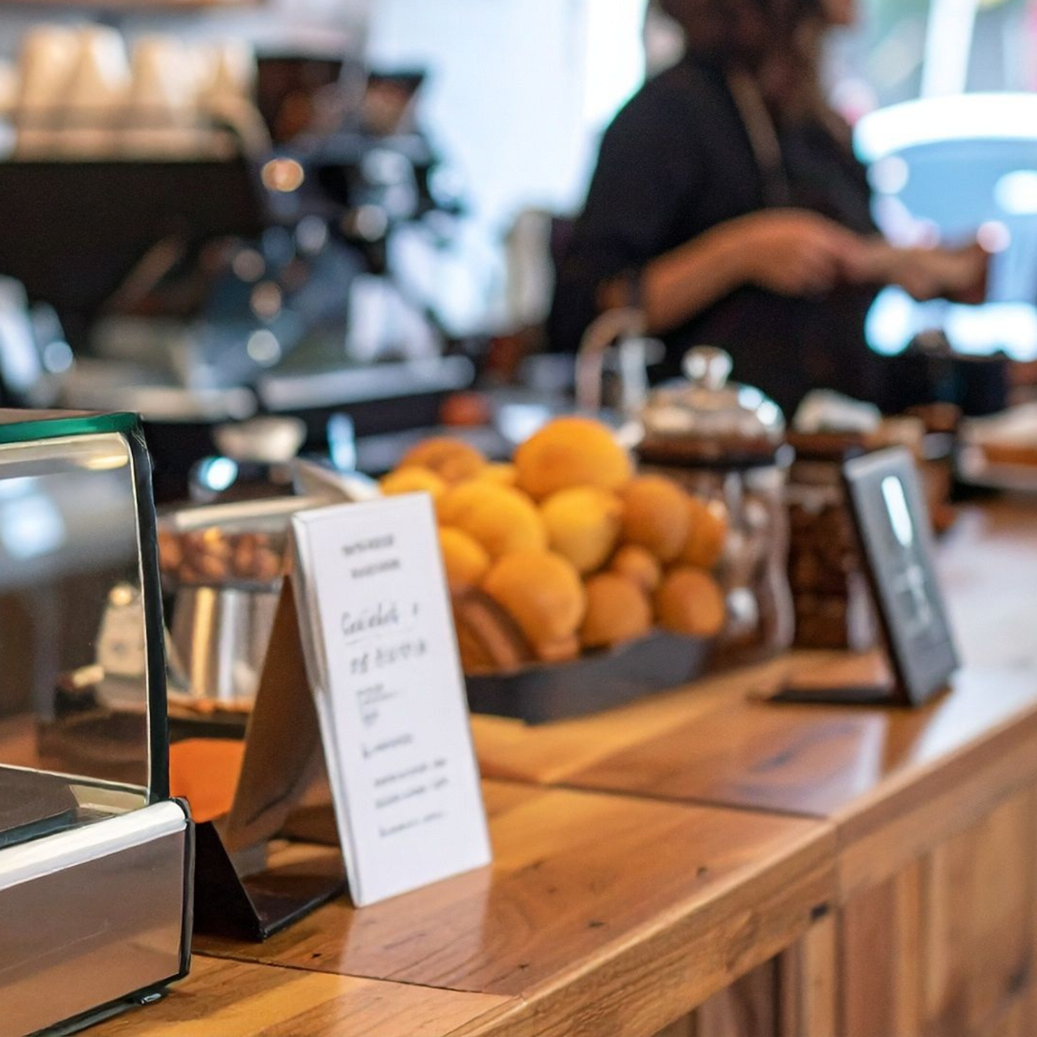 Counter of the shop with a chalkboard menu and morning light.